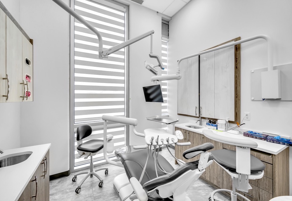 Calgary dental office operatory with zebra blinds on floor-to-ceiling windows